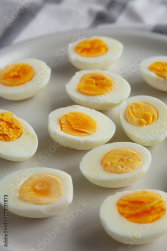 Cooked Hard Boiled Eggs on a Plate, side view.