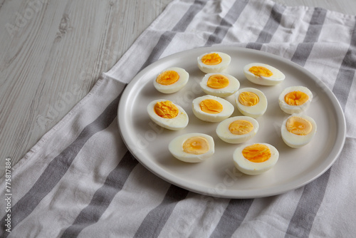 Wallpaper Mural Cooked Hard Boiled Eggs on a Plate, side view. Copy space. Torontodigital.ca