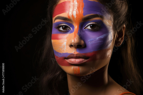 A woman's face painted with vibrant blue, orange, and white, evoking the free-flowing creativity and expression of abstract art.
