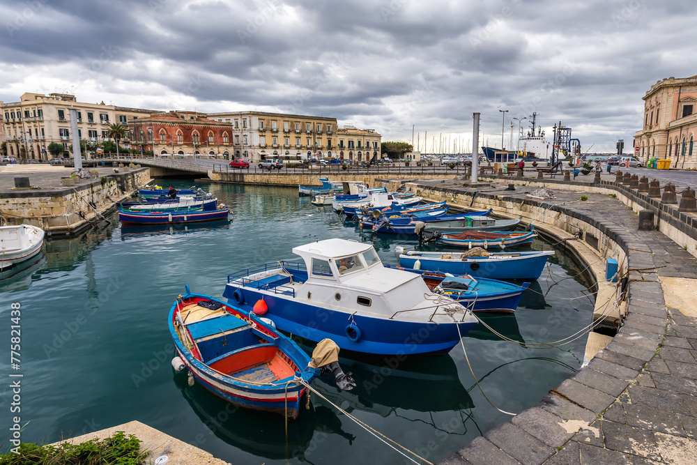 Fishing boats in port of Syracuse city, Sicily Island, Italy