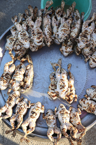 Fried frogs. San-pa-tong buffalo market, Saturday bazaar, fair in Chiang Mai city, Thailand. Thai traditional national market, exotic cuisine, food, grilled meal, grill