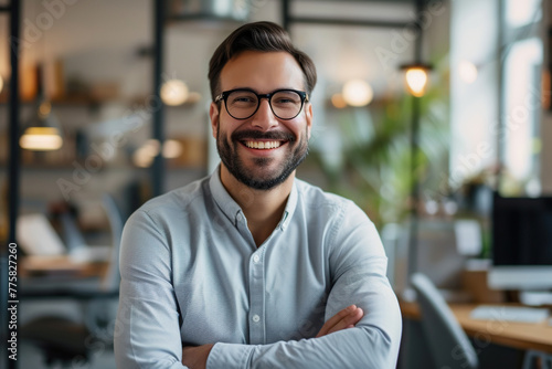 Confident professional in office environment smiling at camera