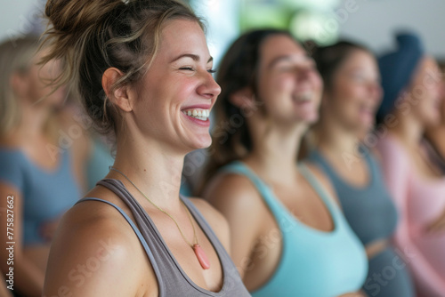 Group of expecting moms in a prenatal yoga class, smiling and practicing wellness © Volodymyr