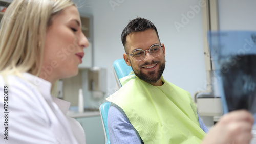 Dentist and patient making a treatment plan together