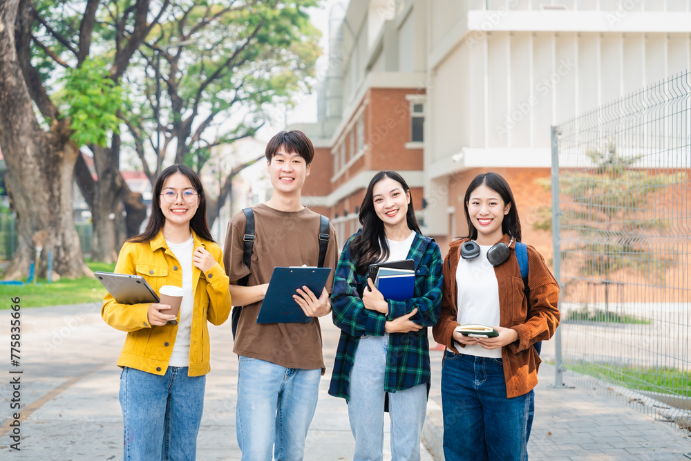 Obraz premium Diverse group of young adults from Asia and beyond, enjoying university life together. happy, learning, and making lifelong friendships, whether in outside class, sunny summer days or cozy weekends
