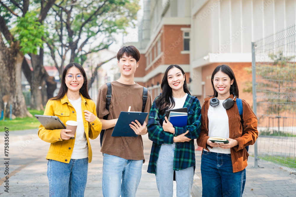 Obraz premium Diverse group of young adults from Asia and beyond, enjoying university life together. happy, learning, and making lifelong friendships, whether in outside class, sunny summer days or cozy weekends