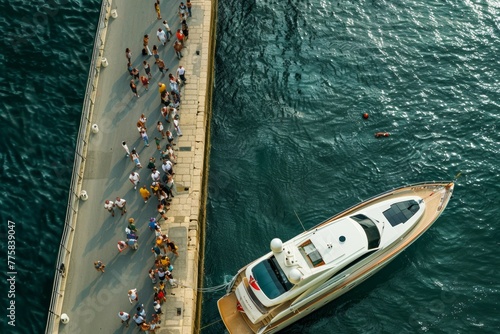 aerial view of a luxury yacht gracefully cruising the clear blue waters, an unparalleled experience of sea exploration photo