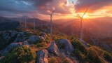 wind turbines on a mountain top, with a sunset sky and mountains in the background. green energy