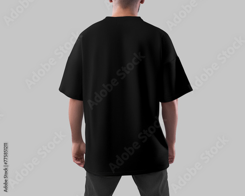 Template of a black oversized T-shirt on a man in dark jeans, back view, for design, print, pattern, branding.