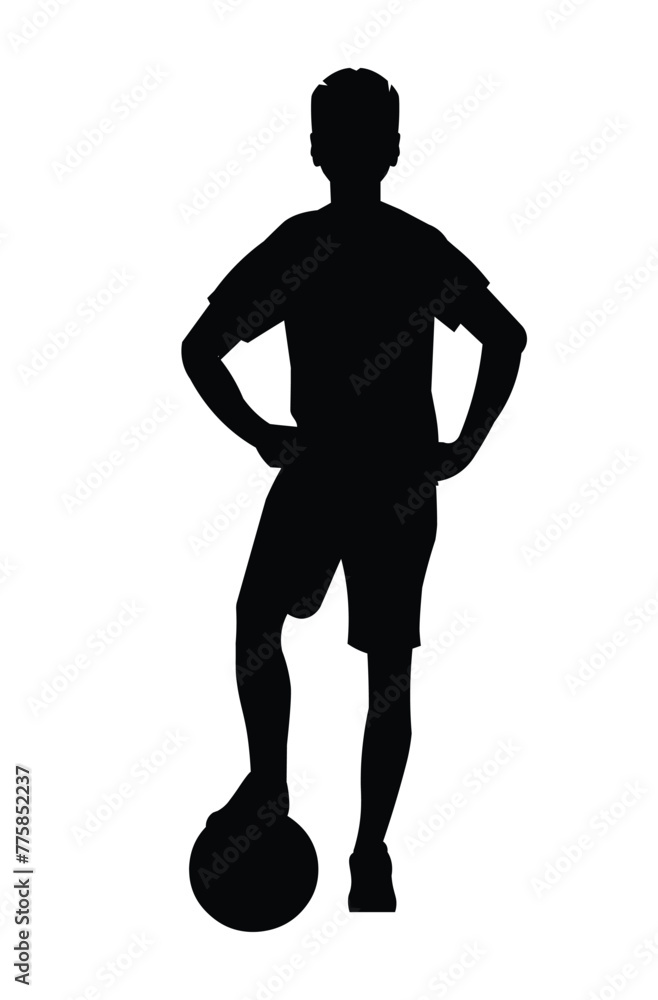 Black silhouette of boy football player who stands upright with his foot on the ball