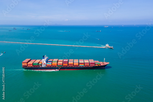 the image provides a stunning aerial view of a bustling cargo ship port, where massive vessels dock and unload their precious cargo.