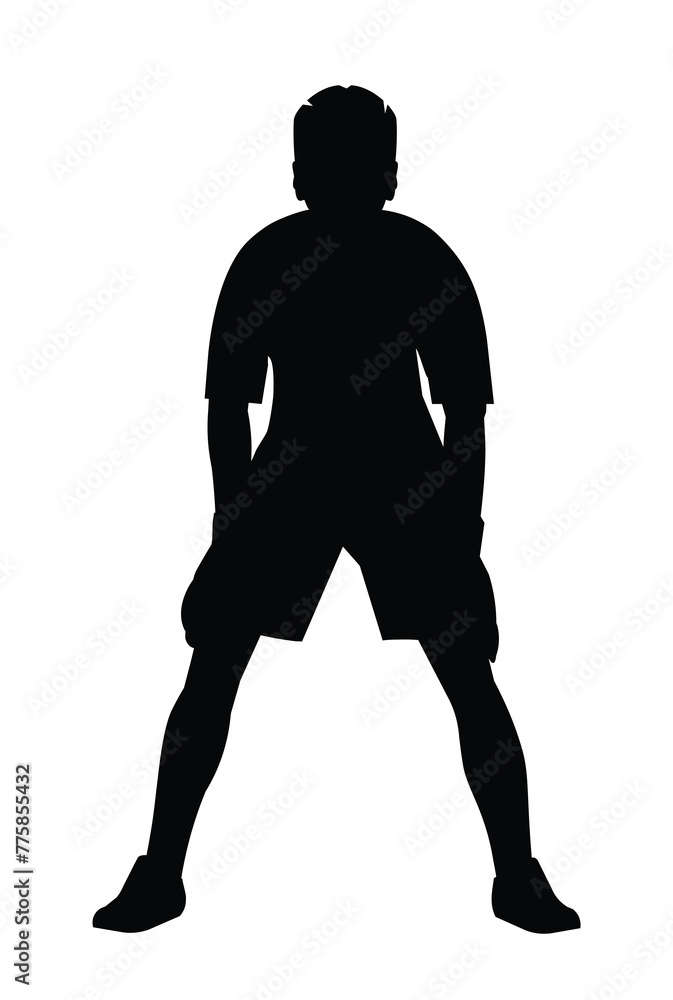 Silhouette of a teenage goalkeeper of junior football teem in gloves who stands upright in goal and waits for the ball