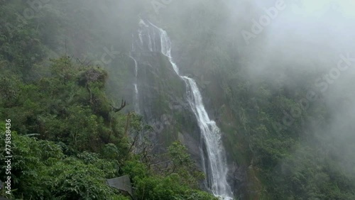 The waterfall is slowly covered by mist photo