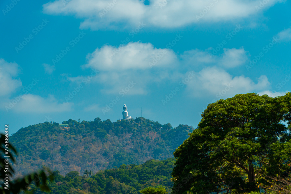 The Phuket Big Buddha statue made of white marble can be seen from a distance among the rows of green hills. Viewed from the top of the hill, Phuket's Big Buddha monument looks majestic and beautiful