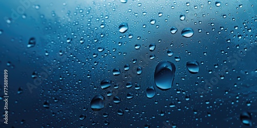 Close up shot of water droplets on a window. Perfect for background use
