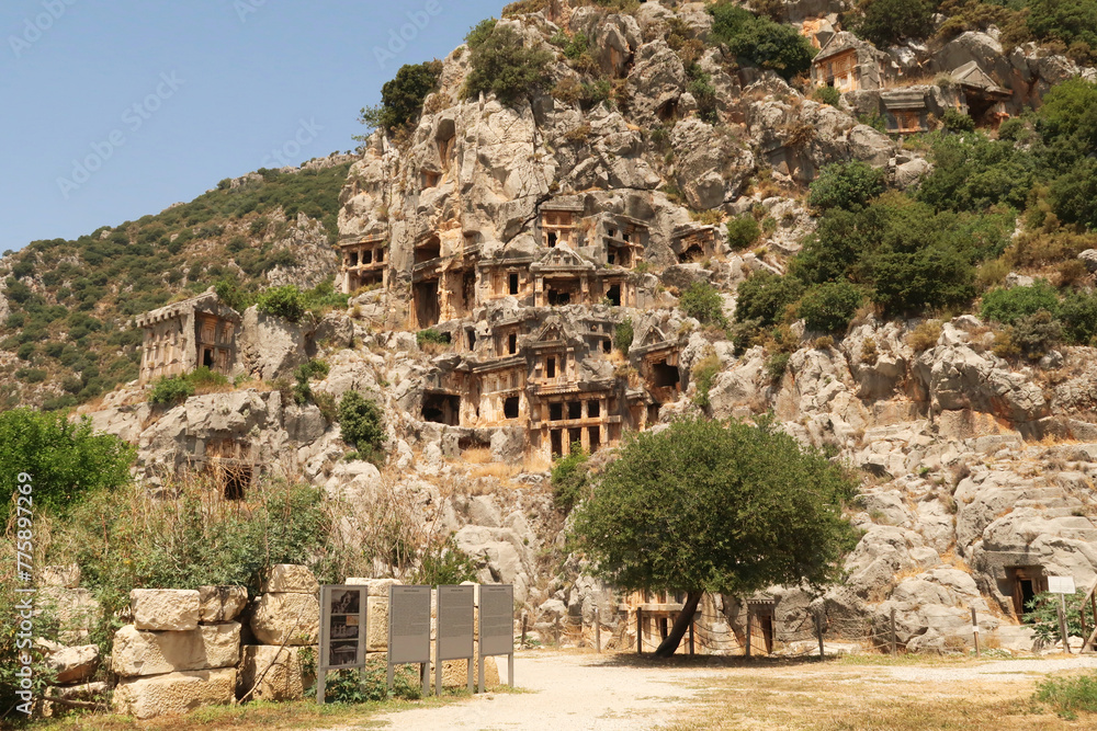 The archaeological site of Myra with its famous rock hewn, rock cut tombs on the cliff in the background, close to Demre, Turkey