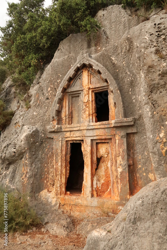 Ancient Lycian rock hewn, rock cut tomb above the coastal town of Kas, Turkey