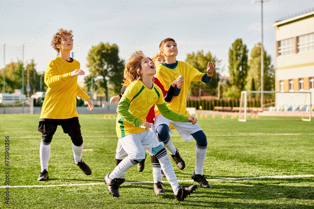 Obraz premium A vibrant group of young individuals enthusiastically playing a game of soccer on a grassy field, running, kicking, and passing the ball with skill and teamwork.