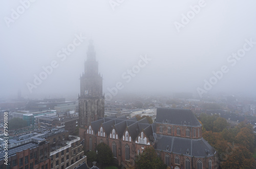 The Martinikerk on a foggy morning in the historical city centre of Groningen.
