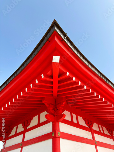 The pagoda is a place of harmony where the energy of the surrounding space is accumulated. Japanese style architecture, red wooden roof close-up. photo