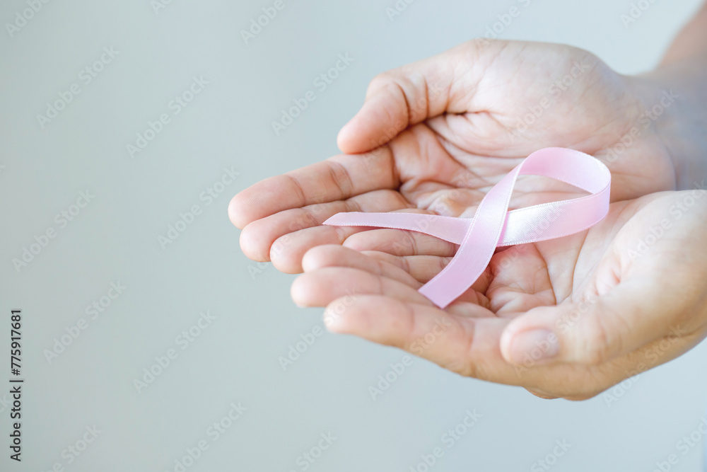 woman with Pink ribbon for patients with breast and cervical cancer woman with Pink ribbon for patients with breast and cervical cancer