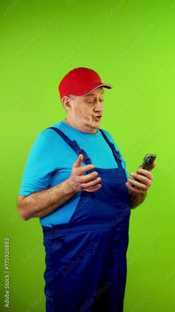 Senior man in overalls talking withclient or customer about future work. Senior man in overalls talking withclient or customer about future work.