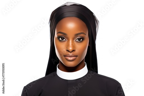 Young Catholic nun - woman in apostolic standing with folded hands quietly smiling sweetly. Catholic nun preparing to serve God in church smiling and rejoicing at opportunity to be useful to people photo