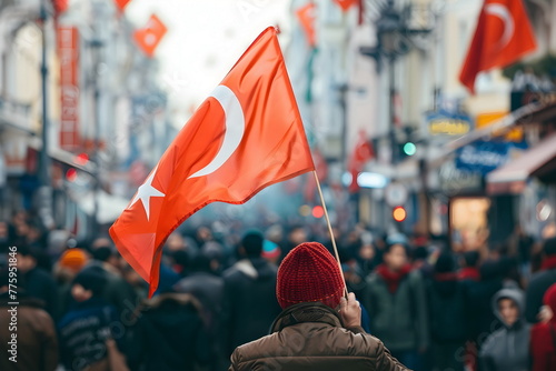 waving turkish flag in a crowd on street photo