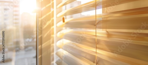Sunlight streaming through closed blinds photo