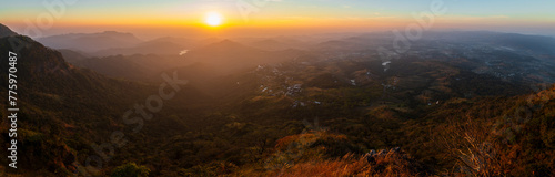 Viewpoint and landscape of high mountain in Khao Kho District of Phetchabun province, Thailand. Panoramic beautiful sunset landscape from the forest into the city. photo