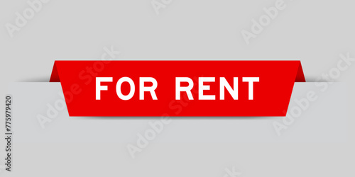 Red color inserted label with word for rent on gray background