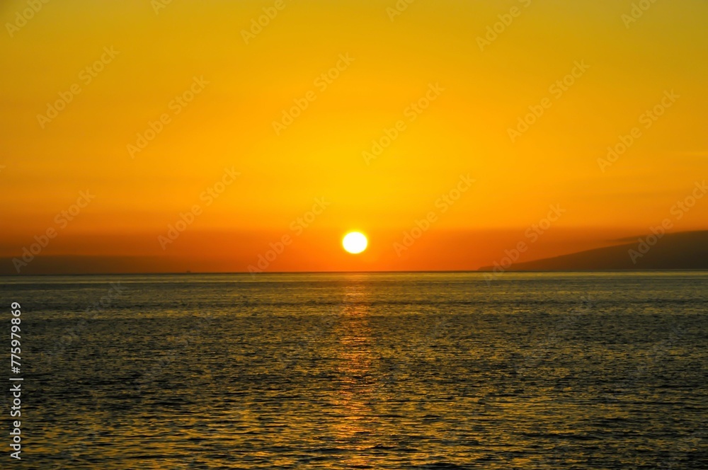 Beautiful shot of a bright orange sunset sky over the Atlantic Ocean