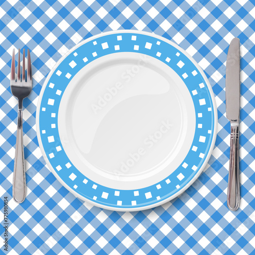 Blue dish with pattern of chaotic white pattern placed on blue check classic table cloth
