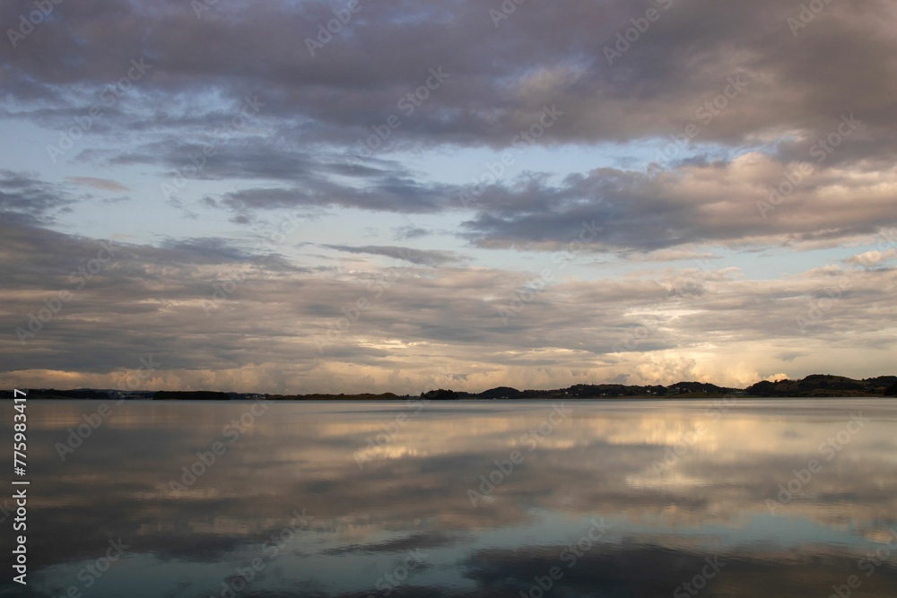 Lake with water reflecting the sky and clouds Lake with water reflecting the sky and clouds