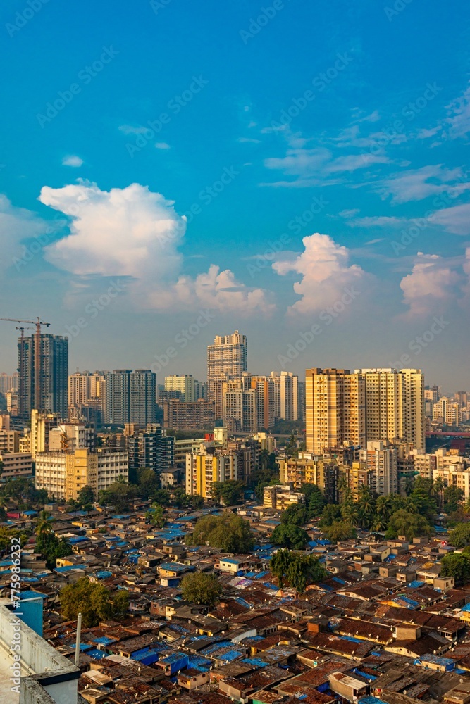 Fototapeta premium Vertical aerial view of modern buildings and houses in Mumbai, India