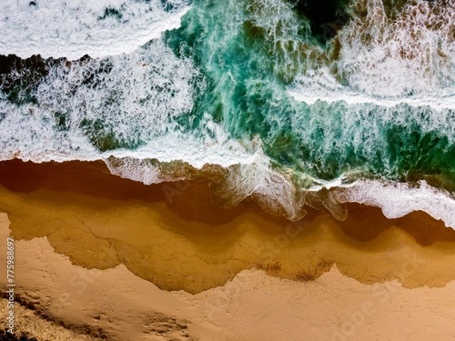 Aerial drone shot of the sea waves washing the Culburra Beach, New South Wales, Australia © Wirestock