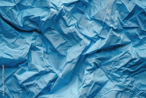 seamless pattern of crumpled expanse of blue fabric