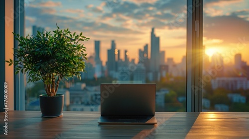 An office at home at twilight with a modern computer setup with a blank monitor screen in front of a window surrounded by potted plants View of the cityscape in the background © เลิศลักษณ์ ทิพชัย