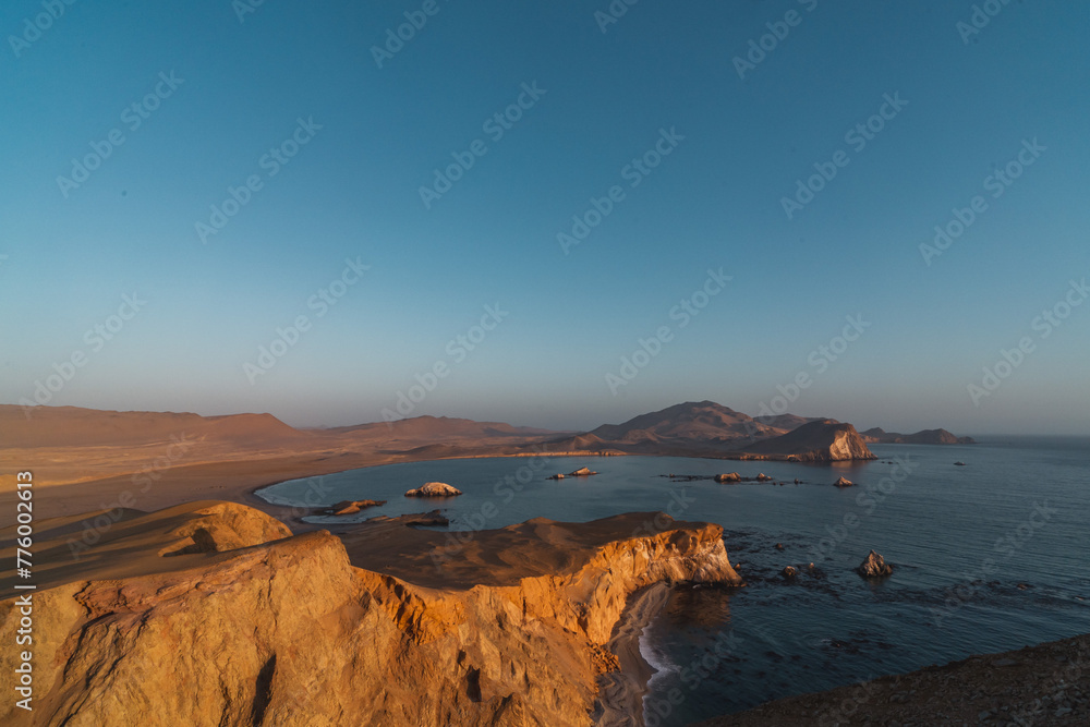 sunset over the sea at the coast of Paracas Peru