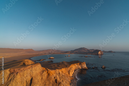 sunset over the sea at the coast of Paracas Peru