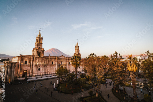view over the main square and white stone church in Arequipa at sunset