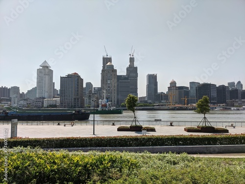 Skyline view of Puxi with the river from Pudong side in Shanghai, China photo