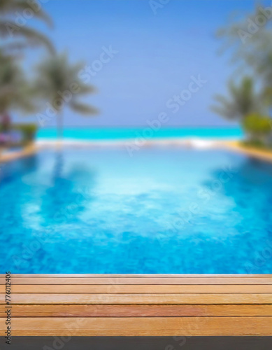 empty wooden table top and blurred swimming pool in tropical resort with blurred background.