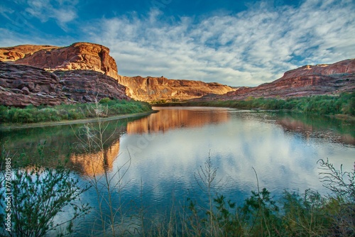 Beautiful view of the Colorado River with canyon cliffs on its banks on a sunny day in Utah photo
