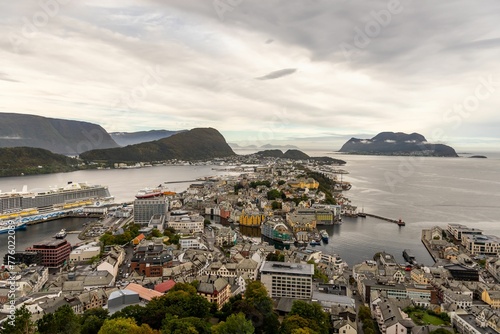 Aerial of the Alesund city surrounded by the North Sea and the hills during the daytime