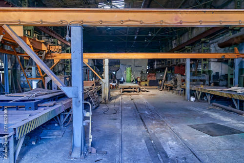 an empty factory floor of abandoned production