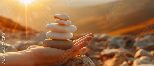 Having an enjoyable life. Harmony and Positive Mind. Hand Setting Natural Stone Stack to Balance. Balancing Body, Mind, Soul and Spirit. photo