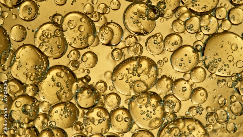 Freeze Motion Shot of Moving Oil Bubbles on Golden Background
