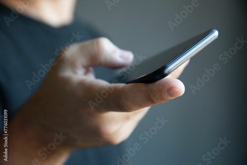 Closeup of a hand holding a smartphone
