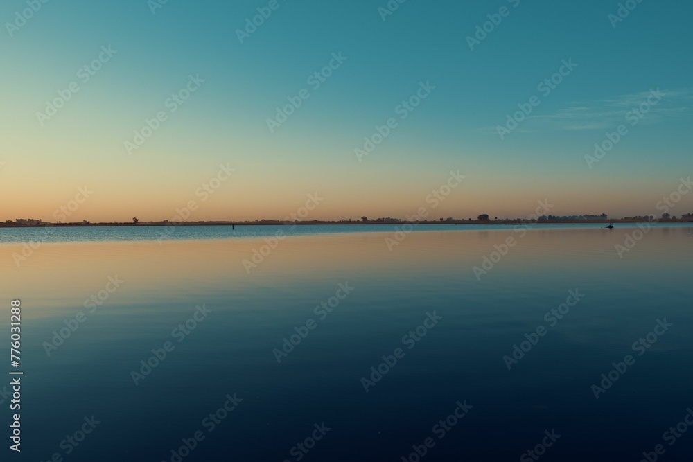 Beautiful shot of a blue sky reflected on a water Beautiful shot of a blue sky reflected on a water